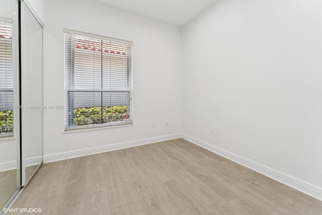 1576 Breakwater Ter, Hollywood, FL 33019 - empty room featuring wood finished floors and healthy amount of natural light