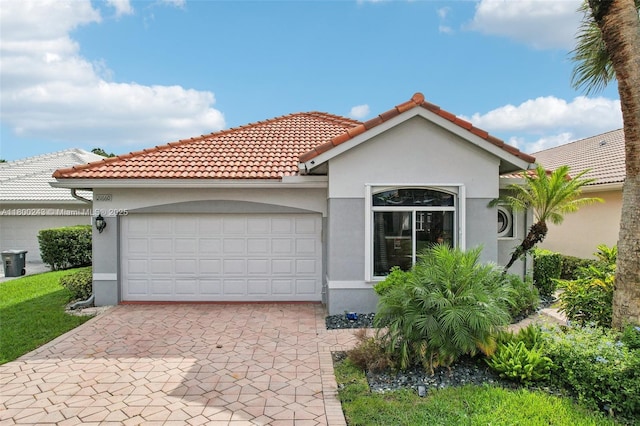 21660 Hammock Point Dr, Boca Raton, FL 33433 - mediterranean / spanish home featuring stucco siding, a garage, driveway, and a tile roof