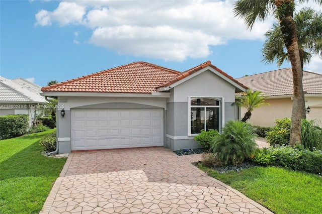 21660 Hammock Point Dr, Boca Raton, FL 33433 - mediterranean / spanish house with stucco siding, a front lawn, and an attached garage