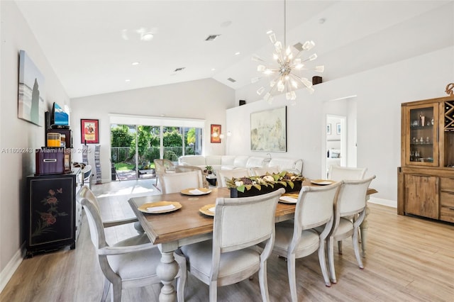21660 Hammock Point Dr, Boca Raton, FL 33433 - dining area featuring light wood-style floors, a chandelier, high vaulted ceiling, and baseboards