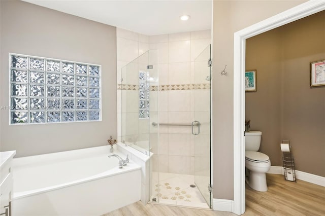 21660 Hammock Point Dr, Boca Raton, FL 33433 - bathroom featuring toilet, a shower stall, a garden tub, wood finished floors, and baseboards
