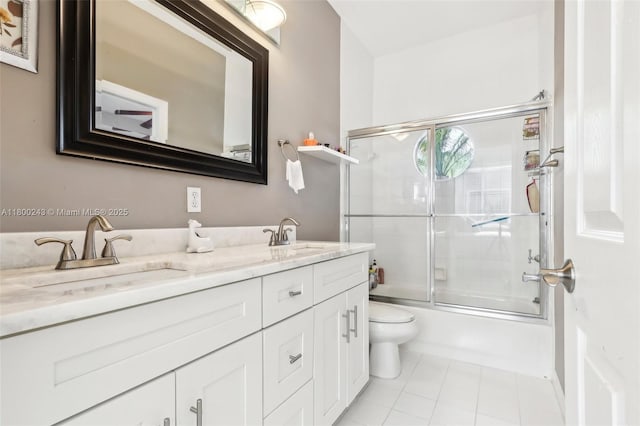 21660 Hammock Point Dr, Boca Raton, FL 33433 - full bathroom with double vanity, tile patterned flooring, bath / shower combo with glass door, and toilet