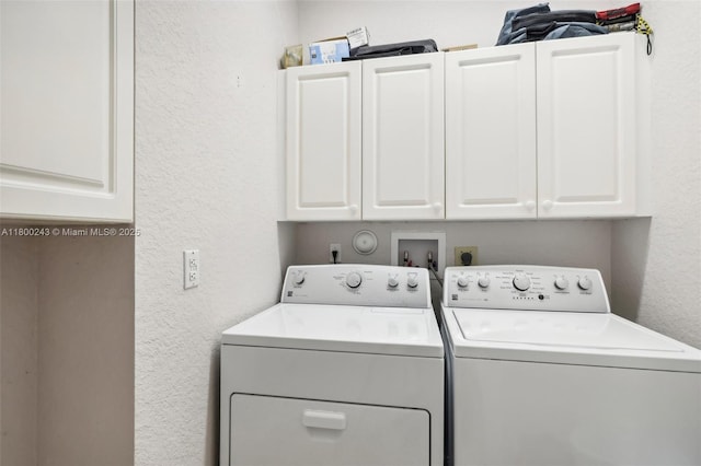 21660 Hammock Point Dr, Boca Raton, FL 33433 - washroom with washing machine and clothes dryer, a textured wall, and cabinet space