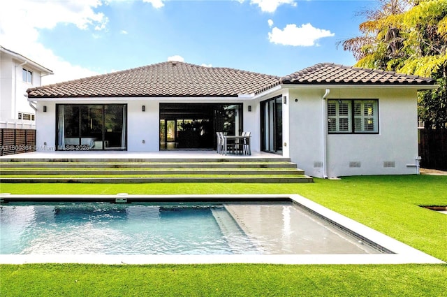 4275 Prairie Ave, Miami Beach, FL 33140 - back of house with a tiled roof, an outdoor pool, stucco siding, and crawl space