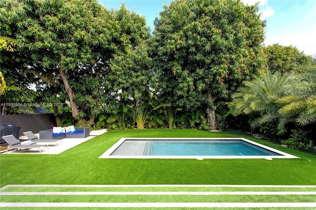 4275 Prairie Ave, Miami Beach, FL 33140 - swimming pool with a lawn and a patio