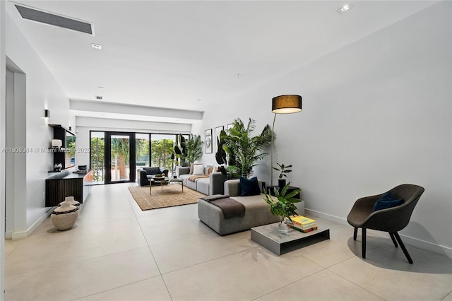 4275 Prairie Ave, Miami Beach, FL 33140 - tiled living area featuring baseboards