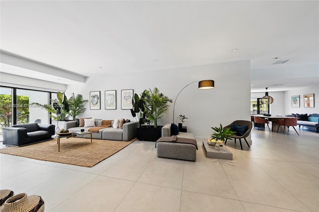 4275 Prairie Ave, Miami Beach, FL 33140 - living area with healthy amount of natural light and light tile patterned floors