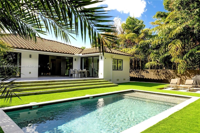4275 Prairie Ave, Miami Beach, FL 33140 - rear view of house with stucco siding, a tile roof, and a patio