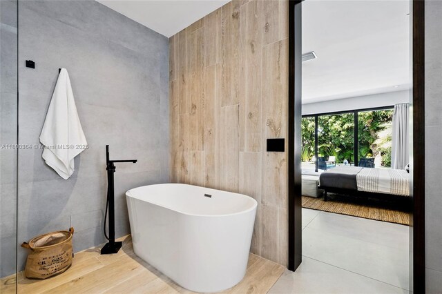 4275 Prairie Ave, Miami Beach, FL 33140 - ensuite bathroom featuring a freestanding tub