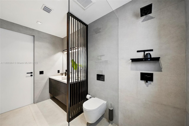 4275 Prairie Ave, Miami Beach, FL 33140 - bathroom with toilet, vanity, and tile patterned floors