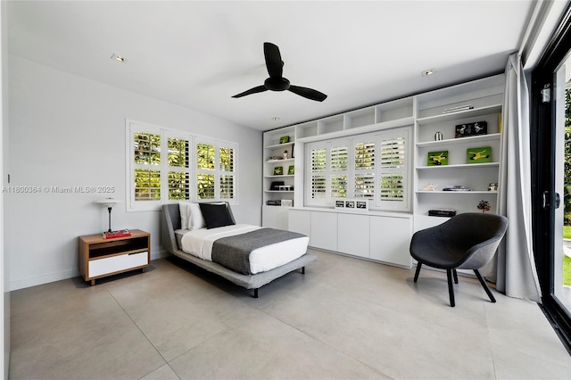 4275 Prairie Ave, Miami Beach, FL 33140 - bedroom with multiple windows, a ceiling fan, and baseboards