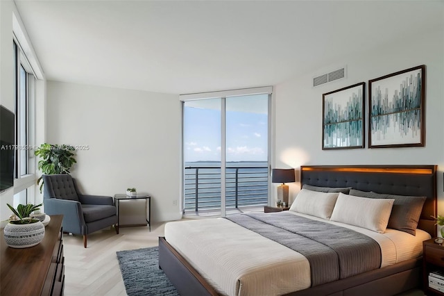335 S Biscayne Blvd Unit 1012, Miami, FL 33131 - bedroom with expansive windows and access to outside