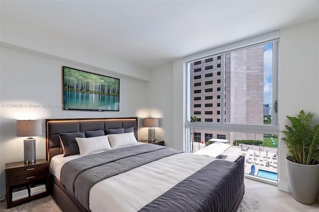 335 S Biscayne Blvd Unit 1012, Miami, FL 33131 - bedroom featuring a wall of windows