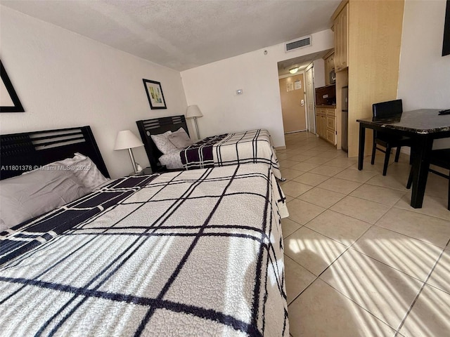 19201 Collins Ave Unit 241, Sunny Isles Beach, FL 33160 - bedroom with light tile patterned floors and a textured ceiling
