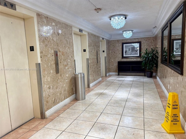 19201 Collins Ave Unit 241, Sunny Isles Beach, FL 33160 - hall featuring crown molding, elevator, a chandelier, tile patterned flooring, and a textured ceiling