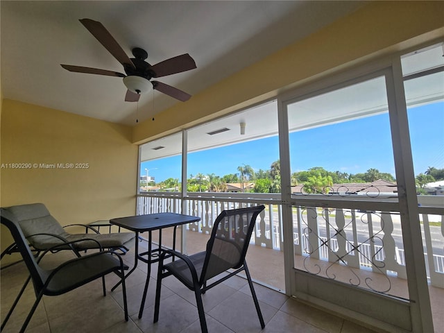 sunroom with ceiling fan and plenty of natural light