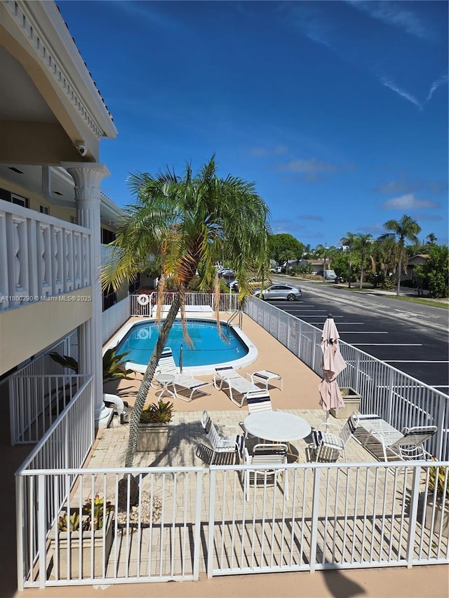 view of pool with fence