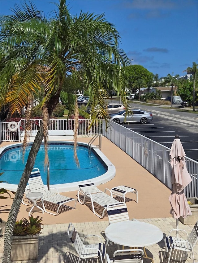 community pool featuring fence
