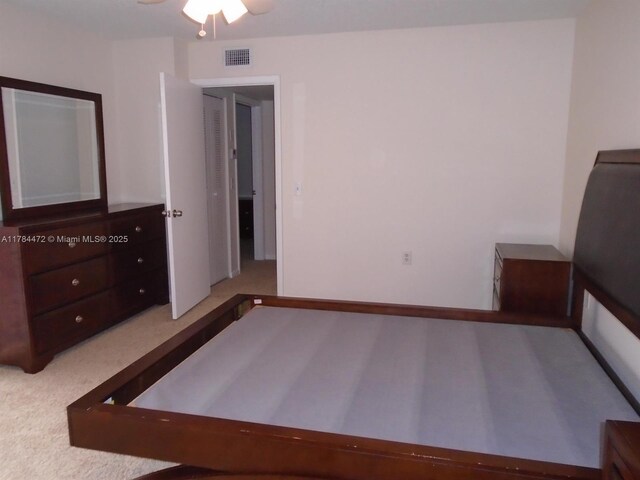 597 Green Springs Pl, West Palm Beach, FL 33409 - unfurnished bedroom featuring carpet floors and a ceiling fan