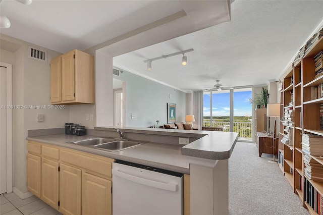 2665 SW 37th Ave Unit 1508, Miami, FL 33133 - kitchen with dishwasher, a sink, light brown cabinetry, a peninsula, and a ceiling fan