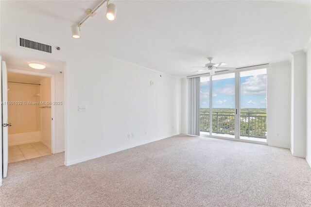 2665 SW 37th Ave Unit 1508, Miami, FL 33133 - kitchen with white appliances, light brown cabinetry, decorative backsplash, and light tile patterned floors