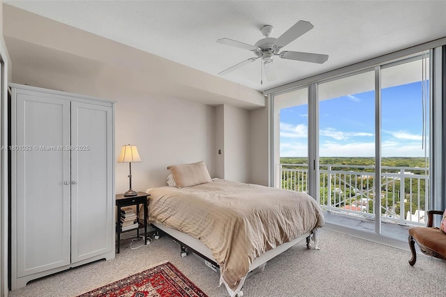2665 SW 37th Ave Unit 1508, Miami, FL 33133 - bedroom featuring light colored carpet, access to exterior, floor to ceiling windows, and ceiling fan