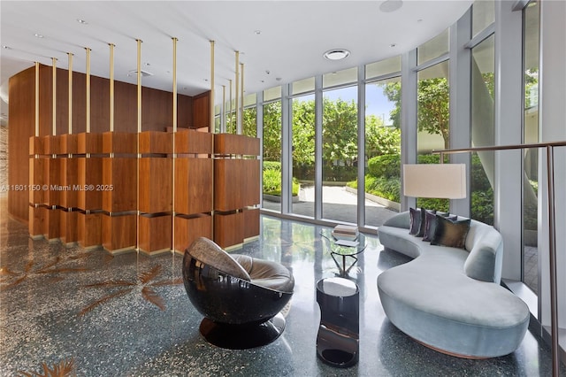 community lobby featuring expansive windows and a high ceiling