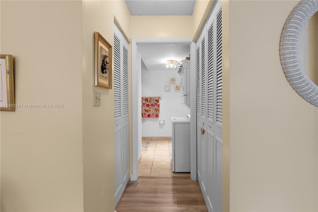 325 NW 72nd Ave Unit 308, Miami, FL 33126 - hall featuring washer / clothes dryer, baseboards, and wood finished floors