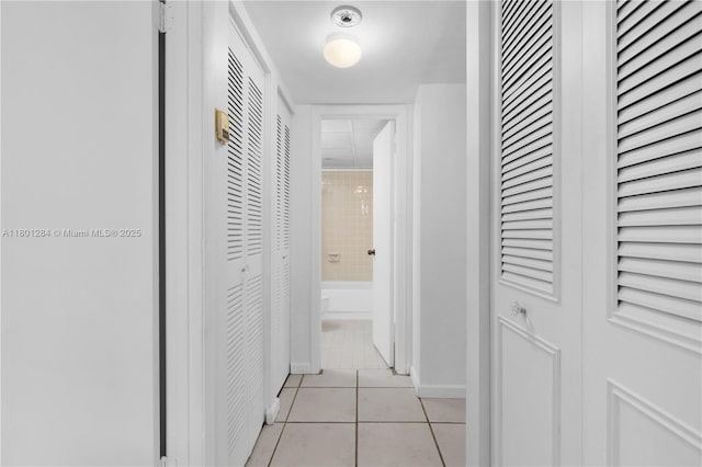 325 NW 72nd Ave Unit 308, Miami, FL 33126 - hallway featuring light tile patterned floors and baseboards