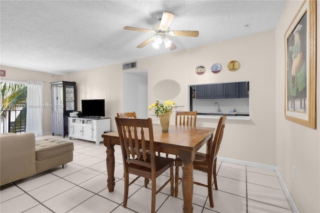 325 NW 72nd Ave Unit 308, Miami, FL 33126 - dining area with a textured ceiling, light tile patterned flooring, a ceiling fan, and baseboards