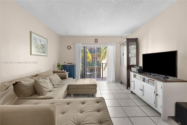 325 NW 72nd Ave Unit 308, Miami, FL 33126 - living area featuring a textured ceiling and light tile patterned flooring