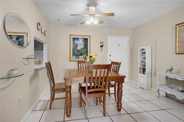 325 NW 72nd Ave Unit 308, Miami, FL 33126 - dining area with a ceiling fan, a textured ceiling, light tile patterned flooring, and baseboards