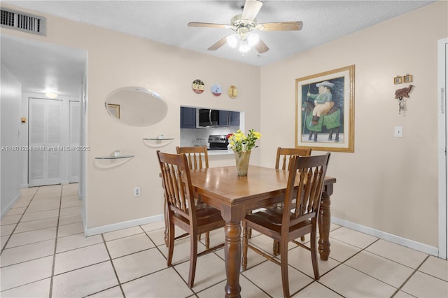 325 NW 72nd Ave Unit 308, Miami, FL 33126 - dining space featuring light tile patterned floors, a ceiling fan, and baseboards