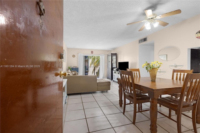325 NW 72nd Ave Unit 308, Miami, FL 33126 - dining room with light tile patterned floors, a ceiling fan, and a textured ceiling