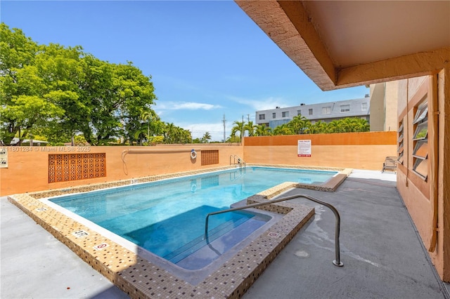 325 NW 72nd Ave Unit 308, Miami, FL 33126 - community pool with fence, a patio, and a hot tub