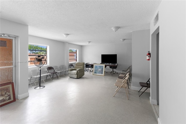325 NW 72nd Ave Unit 308, Miami, FL 33126 - living room with a textured ceiling and baseboards