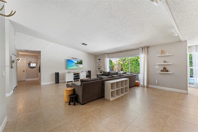 2421 NW 102nd Way, Pembroke Pines, FL 33026 - living area with baseboards, a textured ceiling, light tile patterned floors, and wood walls