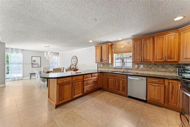 2421 NW 102nd Way, Pembroke Pines, FL 33026 - kitchen featuring stainless steel appliances, brown cabinets, tasteful backsplash, a sink, and recessed lighting