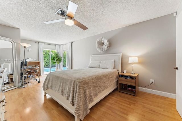 2421 NW 102nd Way, Pembroke Pines, FL 33026 - bedroom featuring access to exterior, a textured ceiling, wood finished floors, a desk, and a ceiling fan