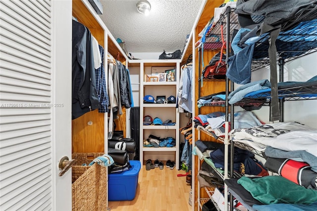 2421 NW 102nd Way, Pembroke Pines, FL 33026 - spacious closet featuring wood finished floors