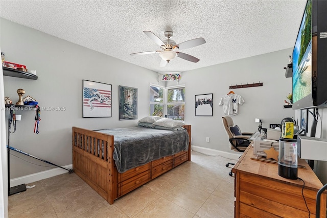 2421 NW 102nd Way, Pembroke Pines, FL 33026 - bedroom featuring a textured ceiling, baseboards, light tile patterned floors, and ceiling fan