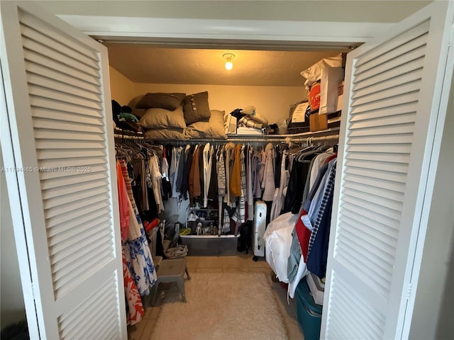 9720 SW 104th Ct, Miami, FL 33176 - spacious closet featuring tile patterned floors