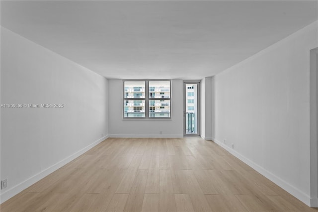 9511 Collins Ave Unit 806, Surfside, FL 33154 - empty room with light wood finished floors and baseboards