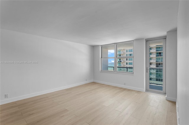 9511 Collins Ave Unit 806, Surfside, FL 33154 - empty room featuring light wood-style floors and baseboards