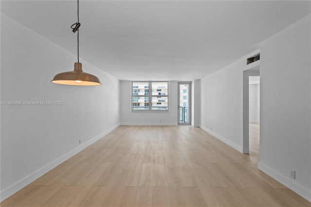 9511 Collins Ave Unit 806, Surfside, FL 33154 - unfurnished living room with light wood-style flooring and baseboards