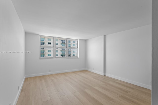 9511 Collins Ave Unit 806, Surfside, FL 33154 - spare room featuring light wood-style flooring and baseboards