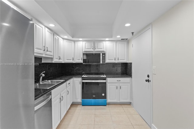 9511 Collins Ave Unit 806, Surfside, FL 33154 - kitchen featuring stainless steel appliances, a sink, recessed lighting, light tile patterned floors, and white cabinetry