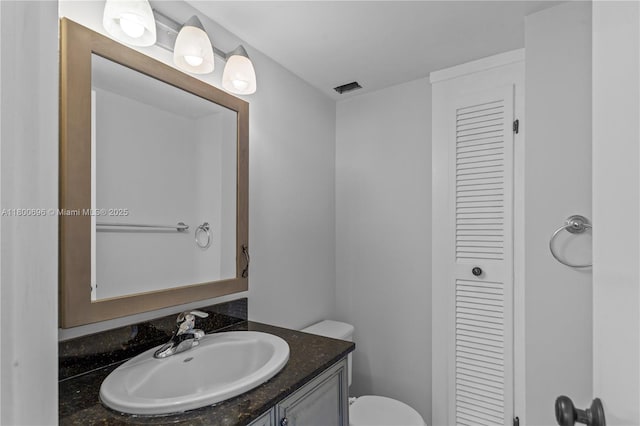 9511 Collins Ave Unit 806, Surfside, FL 33154 - half bathroom with vanity, toilet, and a closet