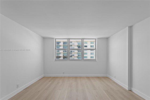 9511 Collins Ave Unit 806, Surfside, FL 33154 - unfurnished room with light wood-type flooring and baseboards