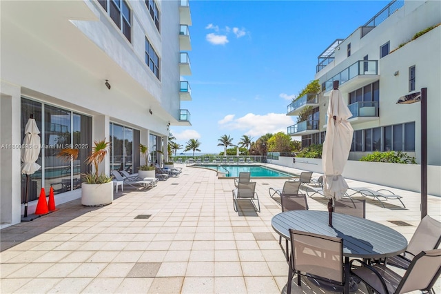 9511 Collins Ave Unit 806, Surfside, FL 33154 - community pool featuring a patio area